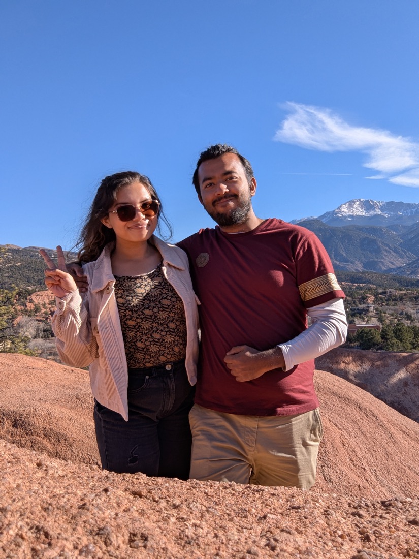 The Lassi Lab founders outdoors in front of a mountain range